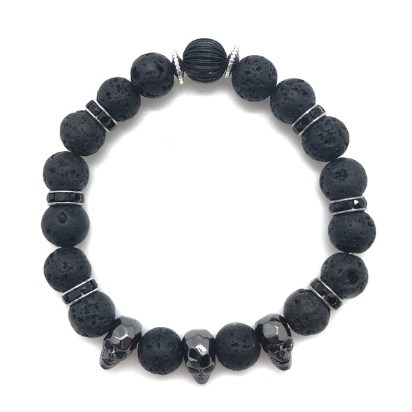 The upscale Bones Bracelet from MancessoriesUSA features three Faceted Metal Skulls with a gunmetal finish. The six accents are Genuine Swarovski® Rhodium Plated Jet (Black) Crystal Rondelles interspersed with black lava beads.