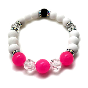 The Trixie Bracelet features Pink Resin Beads from Germany, Swavorski® Clear Round Crystals and Rondelles in Rhodium, and Matte White Agate.