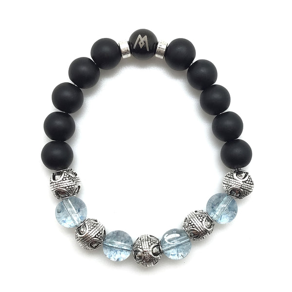 The MancessoriesUSA™ Clear Skies™ Bracelet features AAA Grade Natural Blue Topaz Quarts and Onyx, accentuated by Antique Silver Finished Bali-style Beads.