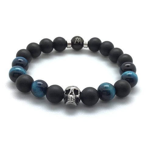 The Midnight™ Bracelet by MancessoriesUSA™ features a durable polished stainless steel skull, onyx and blue tiger eye.