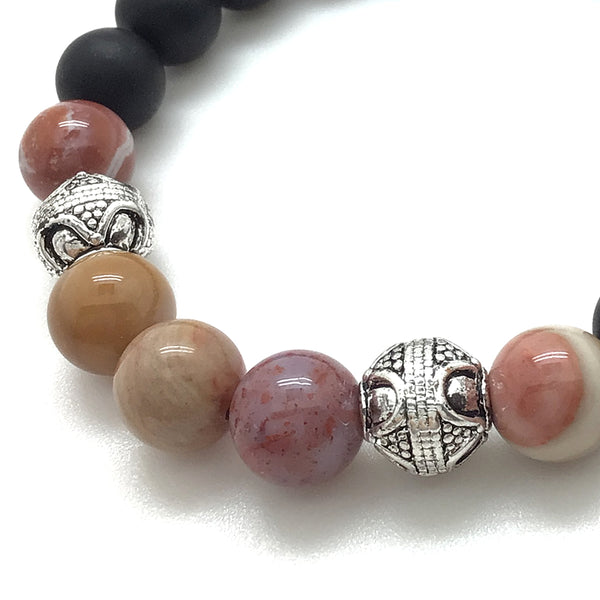 The Redwood™ Bracelet boasts Natural Red Petrified Wood Agate, Matte Black Onyx, and Antique Silver Finished Bali-style accents.