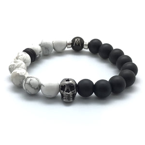 The Smoke™ Bracelet features a polished stainless steel skull, matte onyx, and "marbled" white howlite.