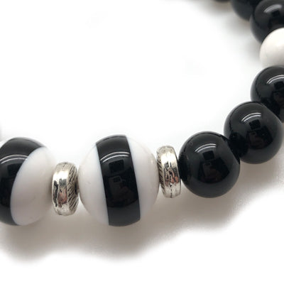 The MancessoriesUSA Nautic Bracelet is cool and sophisticated. Features Black and White Italian Polyester accents, onyx and white marble.