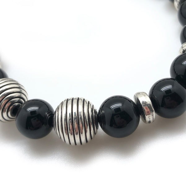 The Silver Bracelet by MancessoriesUSA features two Sterling Silver Wire Wound Spheres surrounded by Gloss Black Onyx semiprecious stones.