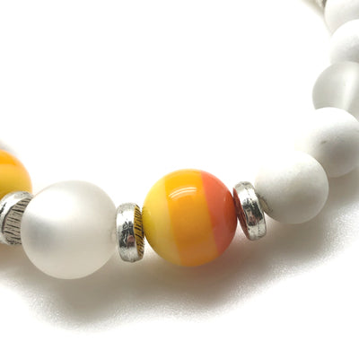 The MancessoriesUSA Sunshine Bracelet features Red-Orange-Yellow banded Italian Polyester and a translucent German Resin beads. 